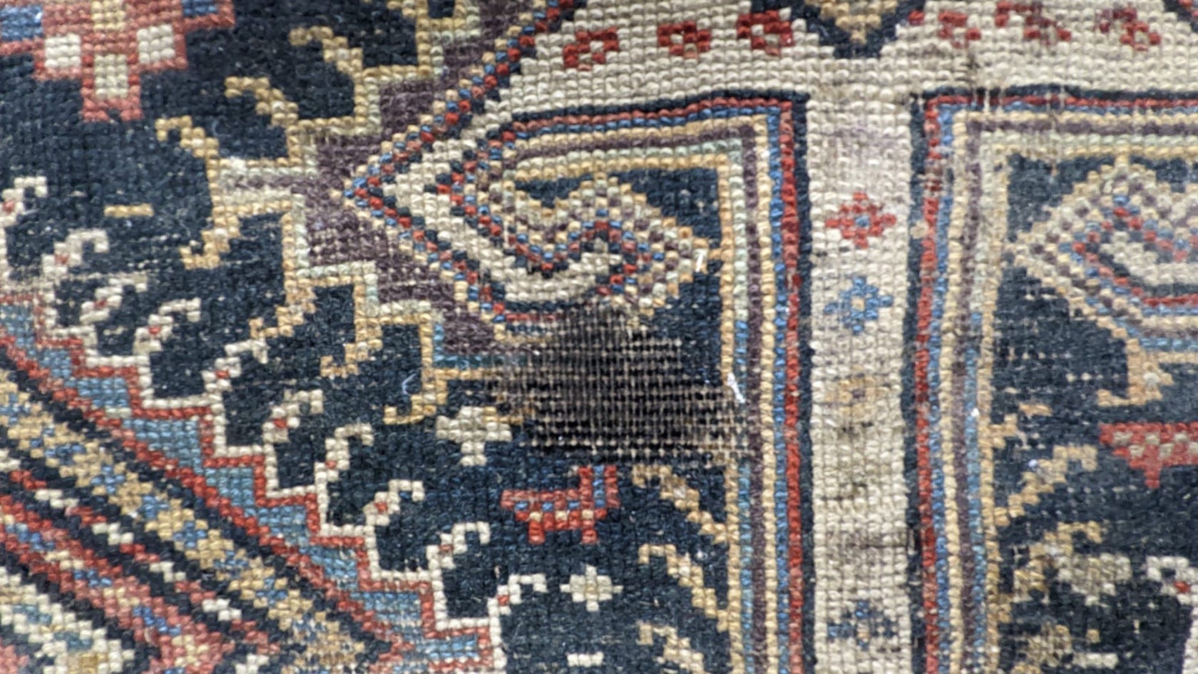 A pair of antique Caucasian blue ground rugs, 290 x 132cm